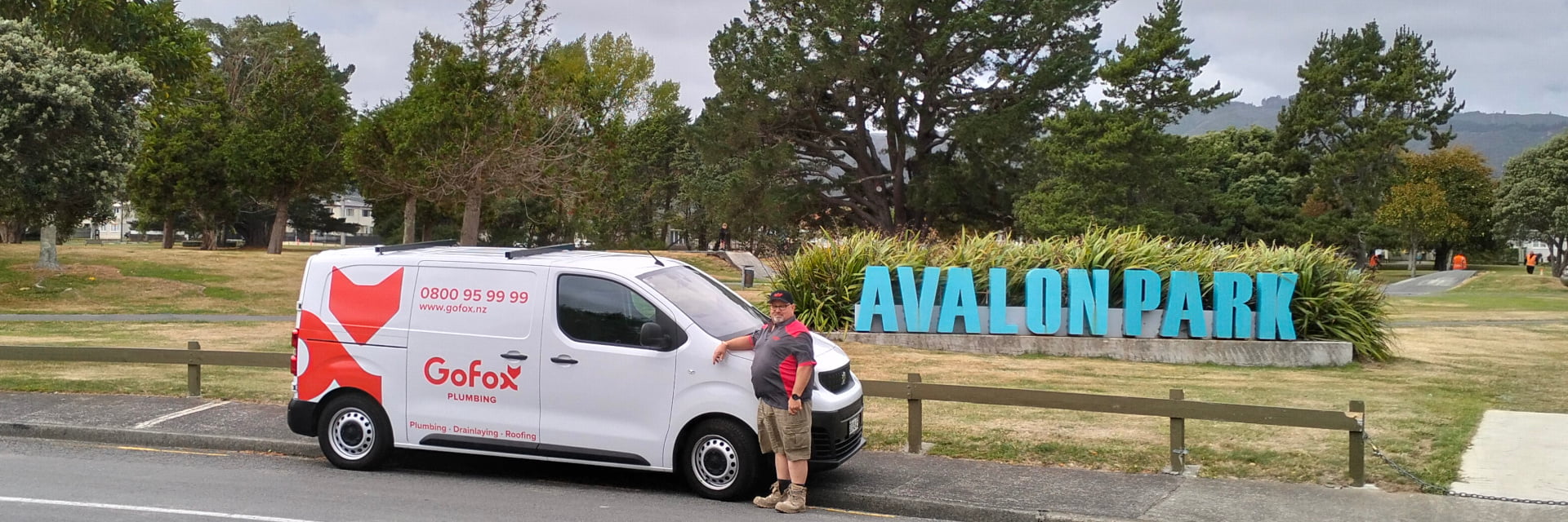 Plumbing Services in Hutt Valley with GoFox Plumbing van parked at Avalon Park, featuring local plumber Willem beside the vehicle