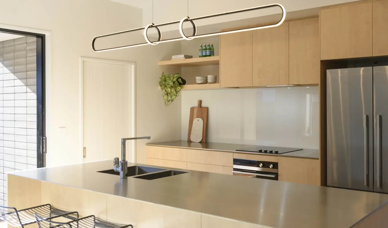 LED Lights installed above a modern kitchen island with pendant fittings, showcasing clean design and bright energy-efficient lighting.