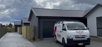 Landlord Electrical Safety Compliance supported by a GoFox Electrical service van parked outside newly built rental townhouses.