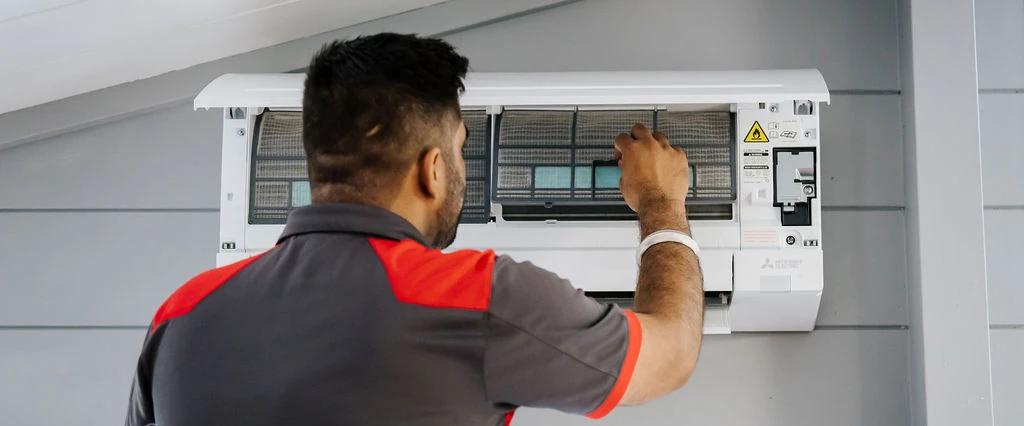 Healthy Homes Standards heat pump installation by a GoFox electrician servicing a wall-mounted unit for rental compliance