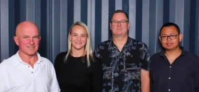 About GoFox head office team standing together in front of a grey backdrop, showcasing the leadership and support behind the GoFox franchise network.