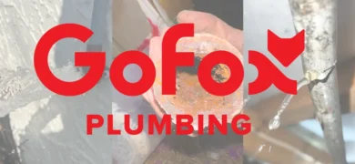 When to Call a Plumber showing a professional GoFox plumber inspecting household plumbing, representing reliable local plumbing services in New Zealand.