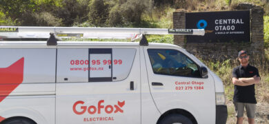 Local electrician Central Otago standing beside GoFox Electrical van with Central Otago sign in background
