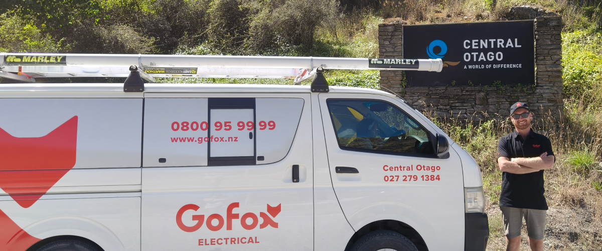 Local electrician Central Otago standing beside GoFox Electrical van with Central Otago sign in background