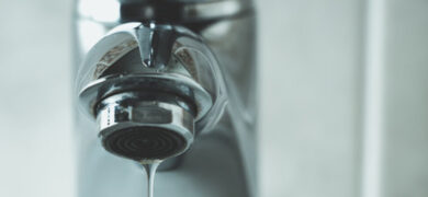 Leaking tap dripping water from a household faucet, illustrating a common plumbing issue that may require repair by GoFox Plumbing.