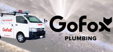 Burst pipe plumbing emergency repair by GoFox Plumbing, showing a GoFox service van beside water spraying from a damaged pipe.