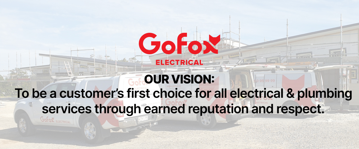 Electrician cost NZ: GoFox Electrical branded service vehicles parked on site with the GoFox logo and company vision statement displayed, representing locally owned professional electrical services across New Zealand.