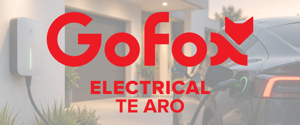 EV Charger Install: wall-mounted home EV charging unit with an electric car plugged in, GoFox Electrical Te Aro branding.