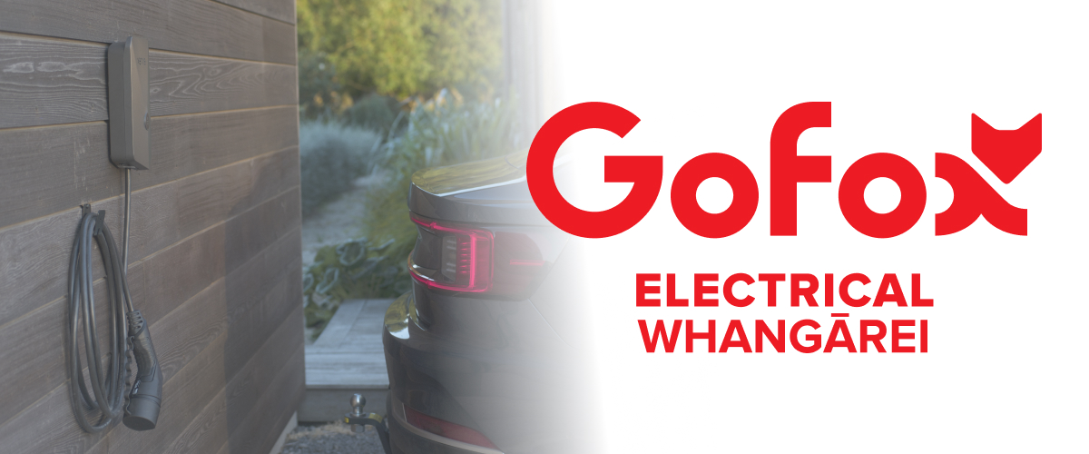 EV charger installation Whangārei: wall-mounted home EV charger with charging cable, parked car beside it, GoFox Electrical Whangārei branding.