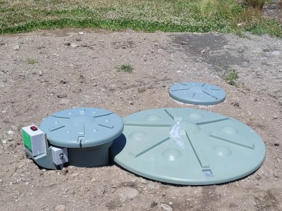 Waste water tank lids showing above ground.
